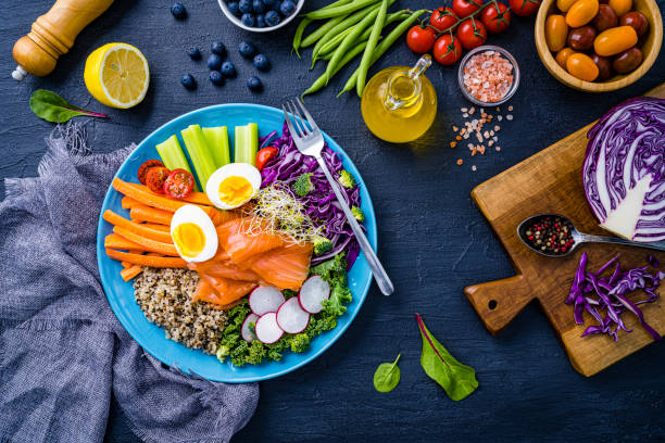 istock Salmon, quinoa and vegetables salad. Healthy heart  diet 2152163092
