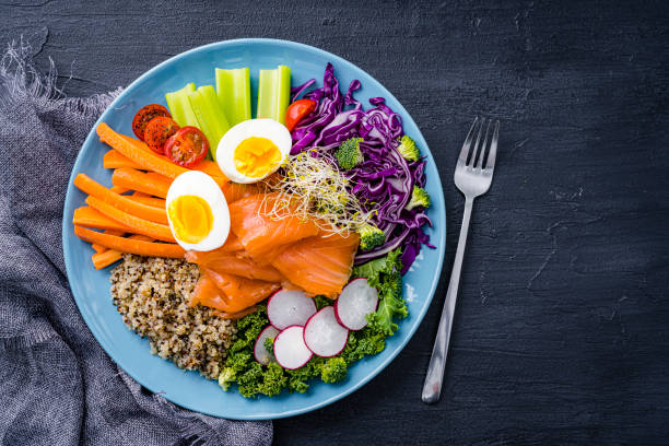 istock Healthy and fresh salmon, quinoa and vegetables salad. 2152163093