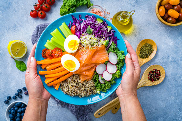 istock Healthy and fresh salmon, quinoa and vegetables salad. 2152163108