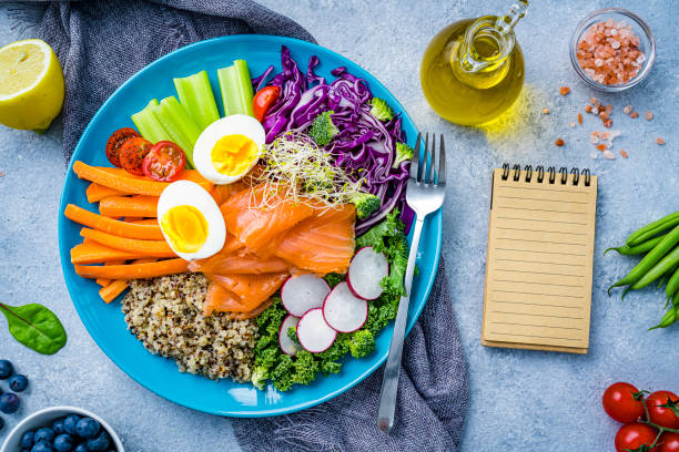 istock Healthy and fresh salmon, quinoa and vegetables salad. 2152163117