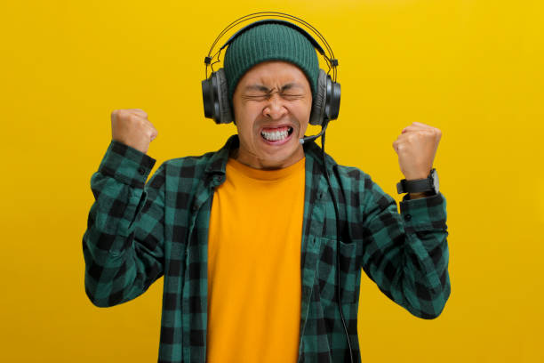 Frustrated Asian Man Listening Music