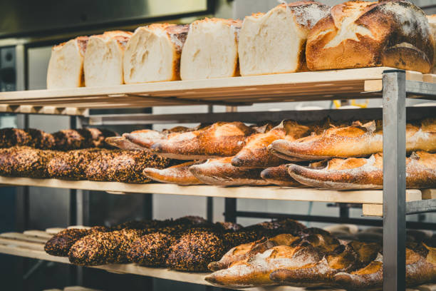 istock Freshly baked bread in a shelf cart in a bakery 2152163617