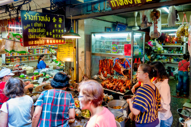 Food sellers in the Talat Kao Old Market in Soi 6 of Yaowarat Road, Bangkok, Thailand