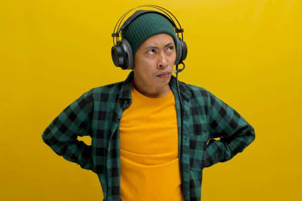 istock Music in His Ears, Frown on His Face 2152166681