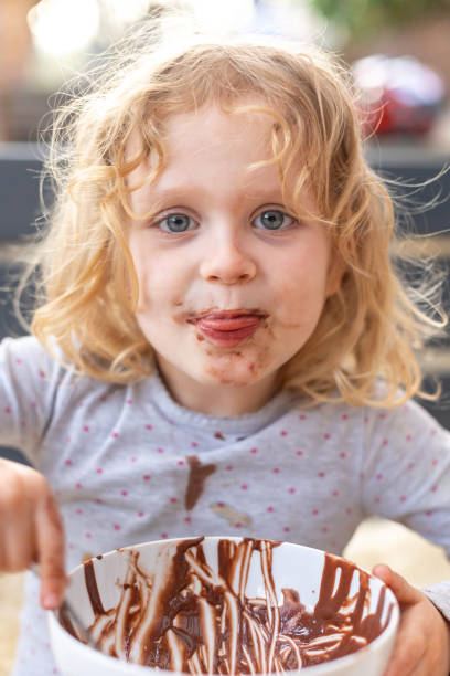 istock Children, kids, siblings, eating chocolate ice cream spring time 2152172883
