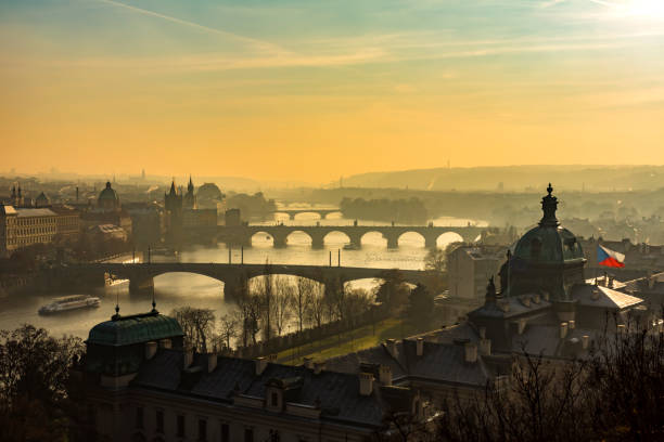 Early morning view of Legion Bridge (Most Legii) over Vltava river and old buildings on waterfront of Prague, Czech Republic