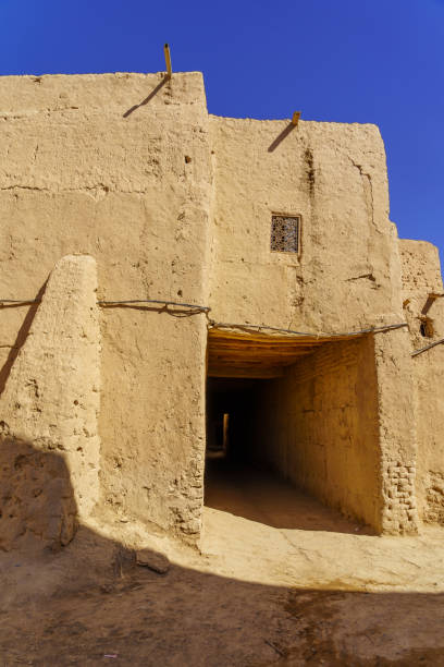 istock Typical mud house village, in the Sahara Desert 2152174584