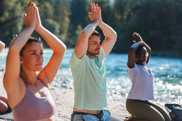 istock Outdoor Yoga Class by the River at Sunrise 2152176332