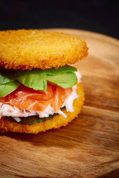 istock sushi menu with burger made from rice and smoked salmon, avocado, light cheese and nori 2152177629