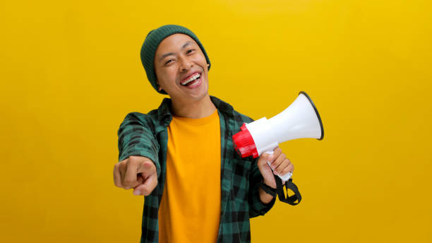 istock Excited Asian Man Shouts into Megaphone 2152178772