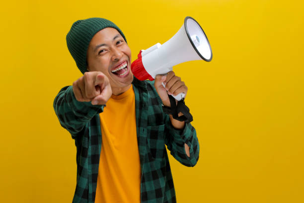 istock Excited Asian Man Shouts into Megaphone 2152178773