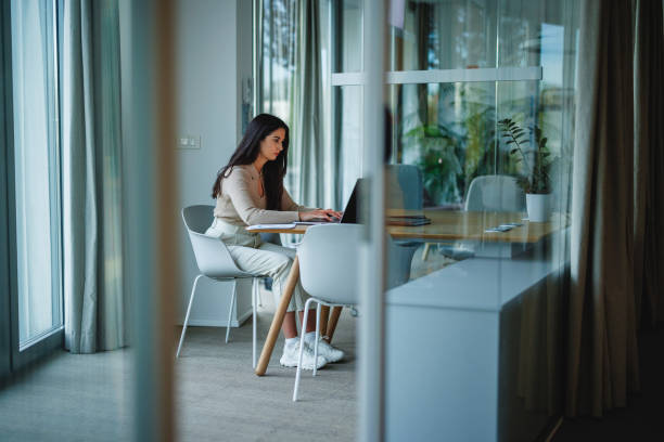 istock Professional Woman Working on Laptop in Modern Office 2152179067