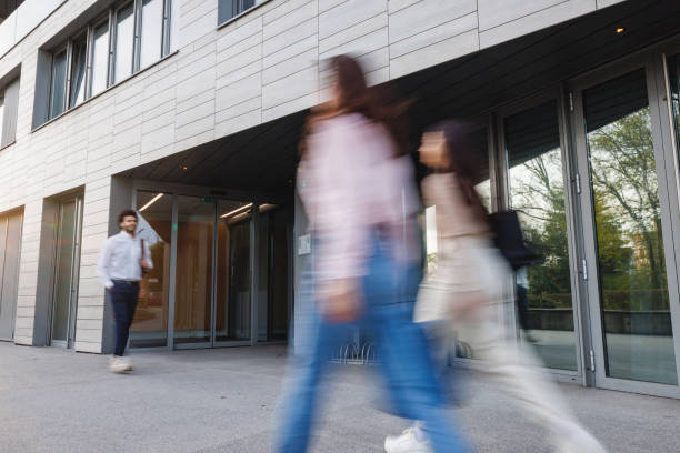 istock Dynamic Office Environment with Blurred Motion of Busy Professionals 2152179074