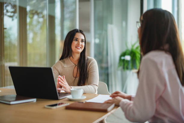 istock Professional Businesswomen Discussing at Office Table 2152179076