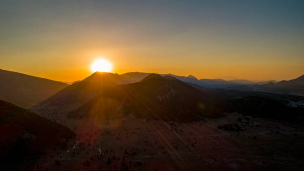 istock Sunset view from behind the majestic mountain. Sunset cloudy sky. 2152179189