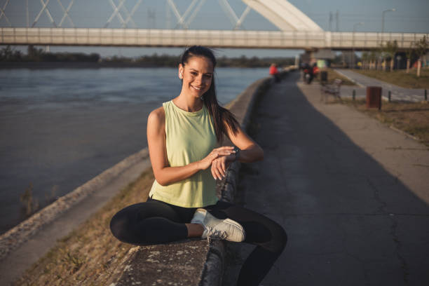 istock Smiling woman checking heart rate after sports training 2152185996