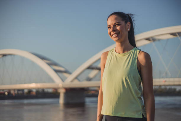 istock Young athletic woman on the river 2152186260
