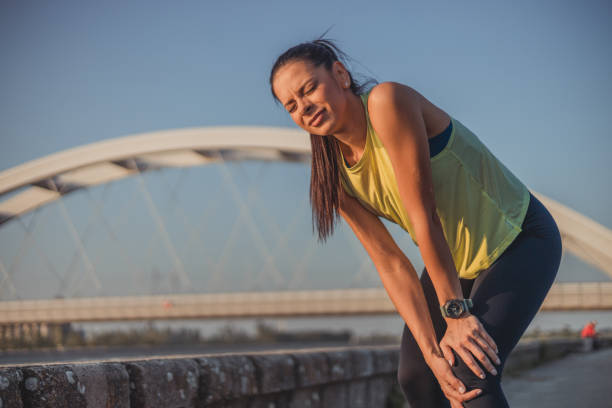 istock Athlete young woman has ankle injury, sprained ankle during running training 2152187601