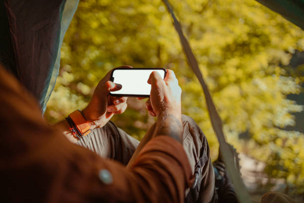 istock Hiking Person with Smartphone White Screen Placeholder 2152188912