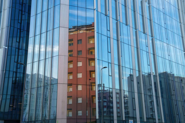 Milan, Italy - December 7, 2023: Milan, Lombardy, Italy: modern buildings along via Faravelli, with reflections
