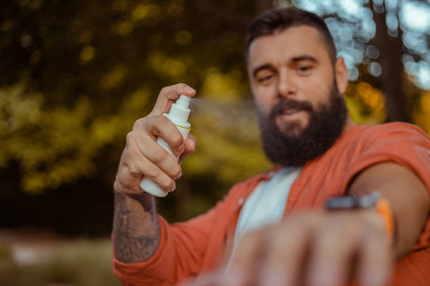 istock Applying Insect Repellent Against Mosquito During Hike 2152189294