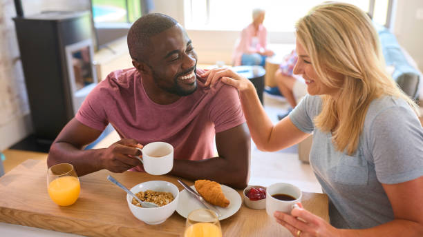 istock Parents Eating Breakfast Together With Three Generation Family In Background 2152192508