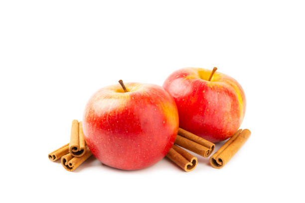 yellow ripe apple with cinnamon on the table, cooking ingredients