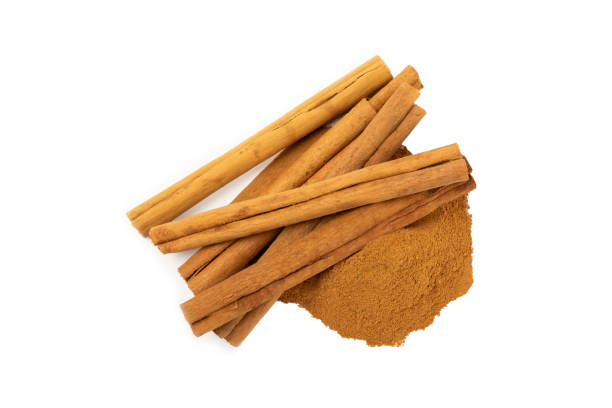 istock Cinnamon powder isolated on white background. Spicy spice for baking, desserts and drinks. Fragrant ground cinnamon. 2152196098