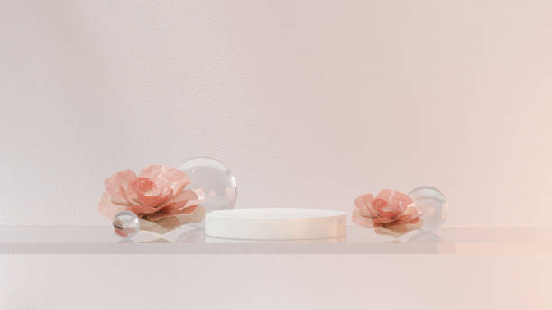 istock 3D product is elegantly showcased on a glass platform adorned with clear glass spheres, illuminated by soft pink-tinted lighting. 2152200156