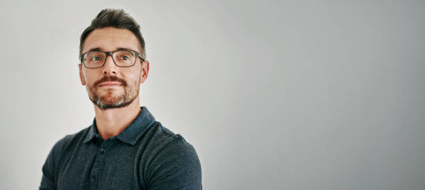 istock Face, space and thinking with mature man on gray wall background for future, planning or vision. Idea, mockup or question and person with beard in glasses for contemplation or problem solving 2152200232