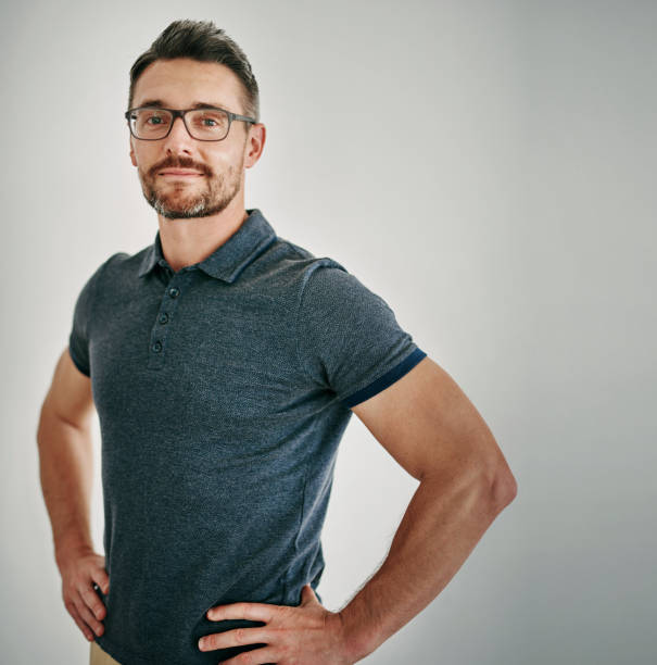 istock Man, portrait and glasses in studio for eye sight or vision on white background for optometry, frames or mockup space. Male person, face and confidence for healthy checkup or spectacles, lens or care 2152200234