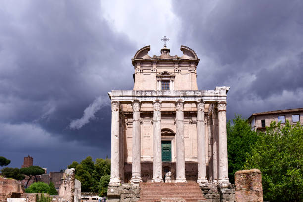 Temple of Antoninus and Faustina  on a dark and threatening sky in Roma, Italy.