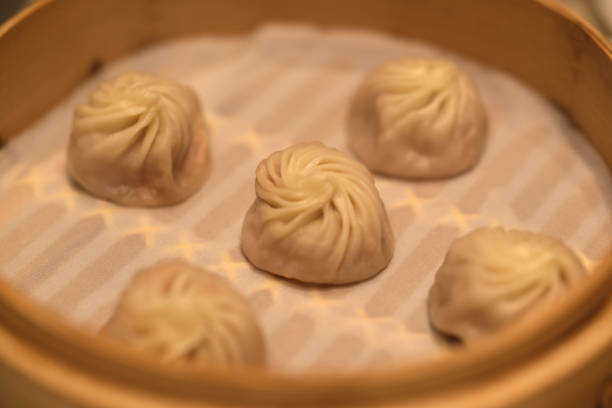 istock several soup buns (Tangbao) in steamer. Chinese dim sum food 2152204005
