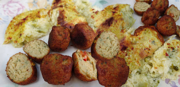 istock Cod accras  Fish balls with poached batter served with zucchini gratin 2152204511