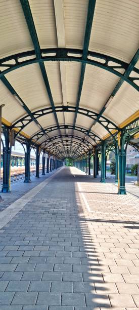 Column and roof steel construction in train station long corridor