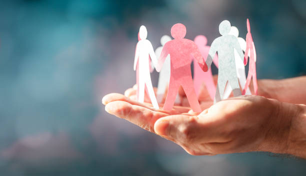 paper chain friends, teamwork, diversity, family or community, hand holding and protecting - vänskapsband bildbanksfoton och bilder