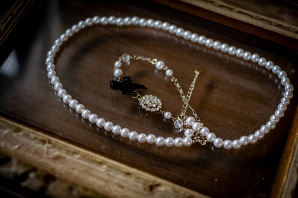 istock Antique picture frames and pearl accessories. 2152206468