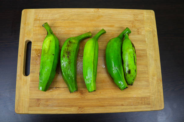 Explore the Vibrant Freshness of Raw Green Bananas, Packed with Nutrients and Potential, Ready to Embark on a Culinary Journey from Garden to Table