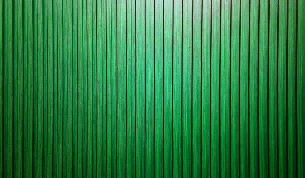 istock vertical wooden slats texture for interior decoration with light from above. abstract green walnut wooden slats in vertical striped line pattern. 2152209234