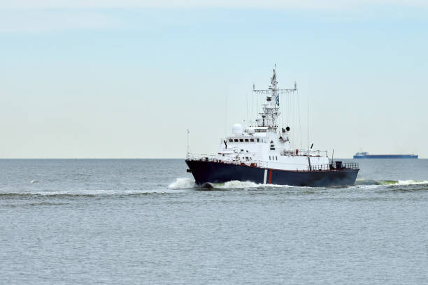 istock Coast guard ship sails along seaside for safeguarding coastal boundaries and maritime interests 2152209306
