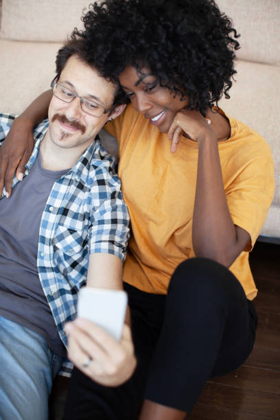istock Happy couple taking a self portrait with mobile phone 2152212071