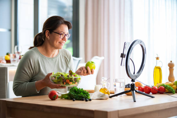 istock Woman filming a haelthy eating class at home 2152213593
