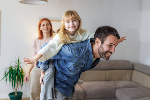 istock Parents playing with their daughter 2152215649