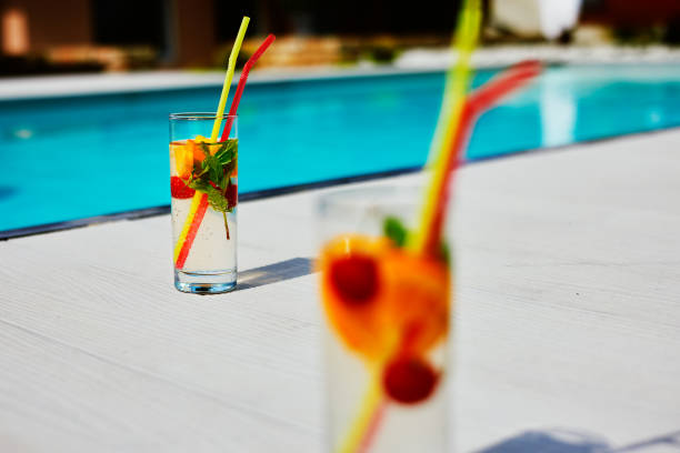 istock Two glass of cocktail by the pool 2152215931