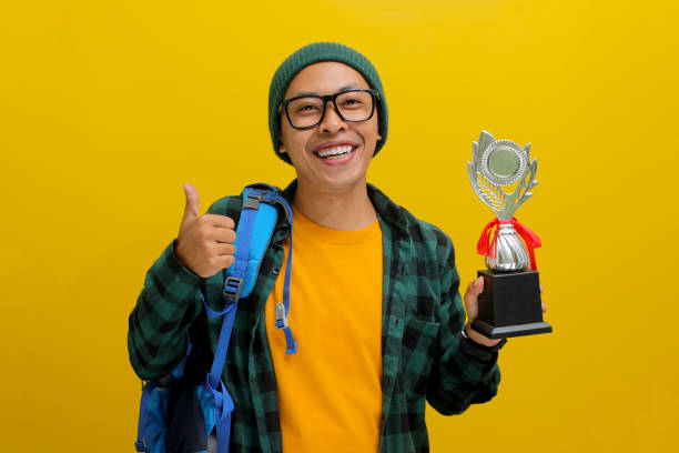 istock Excited Asian student joyfully giving a thumbs up to the camera 2152217867