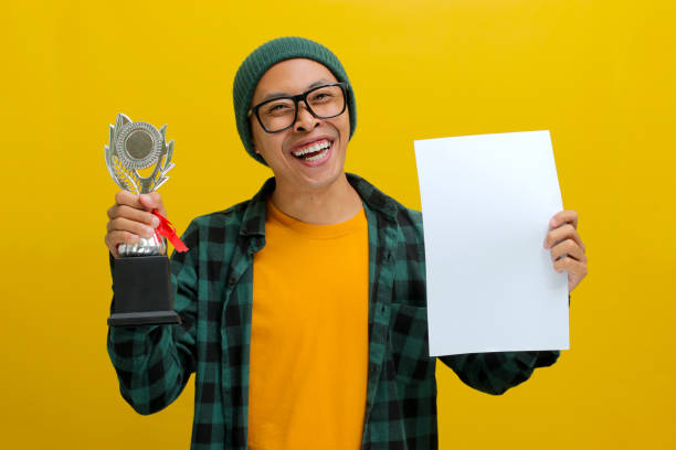 istock Smart Asian Student holds a piece of Paper 2152218770