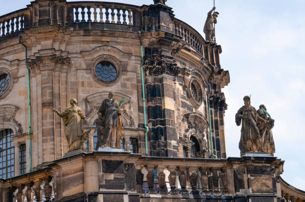 Dresden, Germany - April 18, 2024: Cathedral Katholische Hofkirche on Theaterplatz square.
