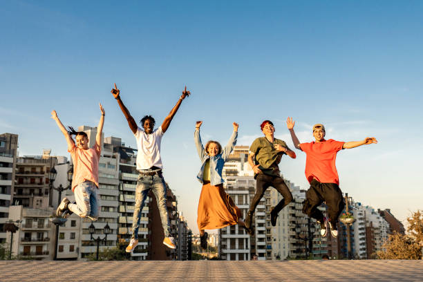 istock Happy millennials friends jumping outdoor 2152222634