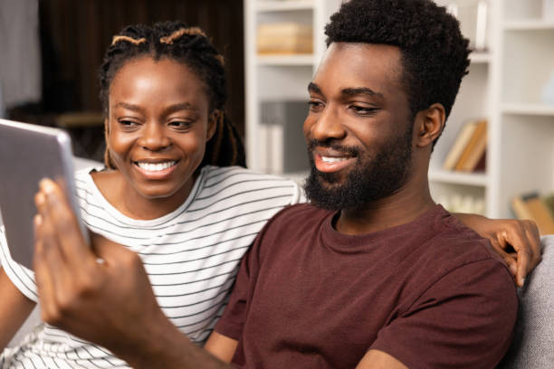 istock Couple Enjoying Time Together With Tablet At Home 2152225203