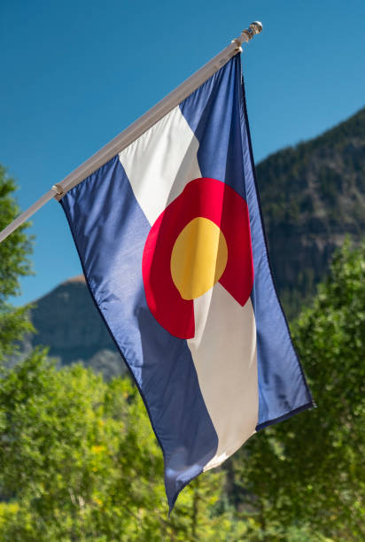 istock Colorado state flag hangs in the Rocky Mountains 2152226041